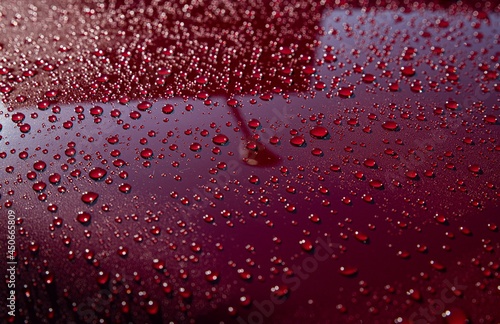 Obraz na płótnie Hydrophobic water effect on red car paint after rain. Water drops on metal surface w salonie