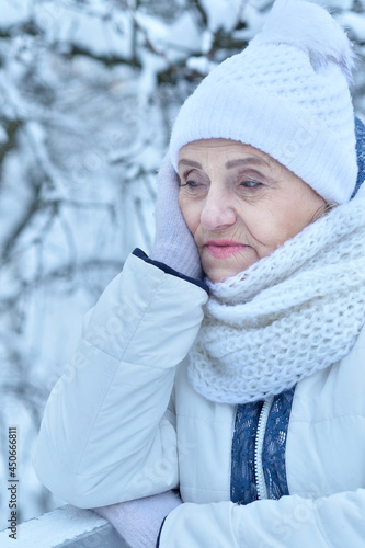 Close up portrait of upset beautiful senior woman