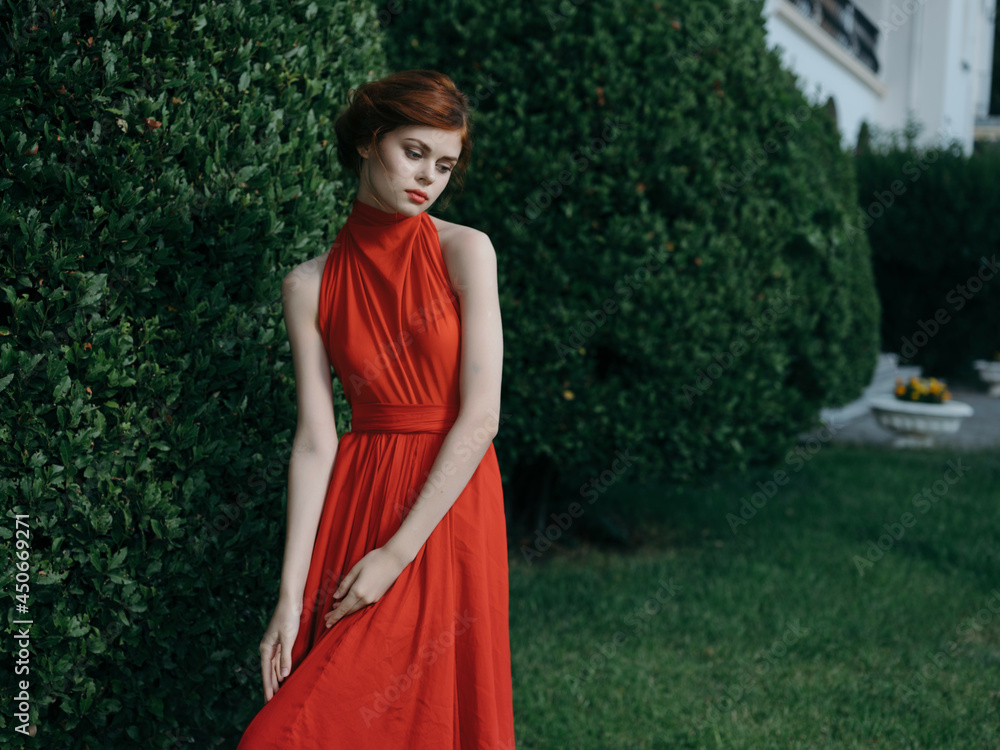 Woman in red dress decoration charm garden nature Woman in red dress decoration charm garden nature