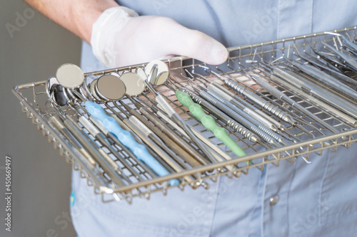 Equipment for the dental office. Orthopedic Instruments. Dental technician with work tools. Dentist metal tools. Closeup photo of dental instruments at clinic