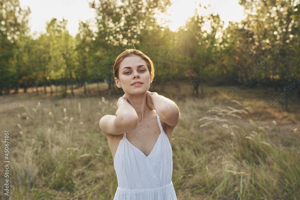 Woman in white dress nature field walk vacation Woman in white dress nature field walk vacation