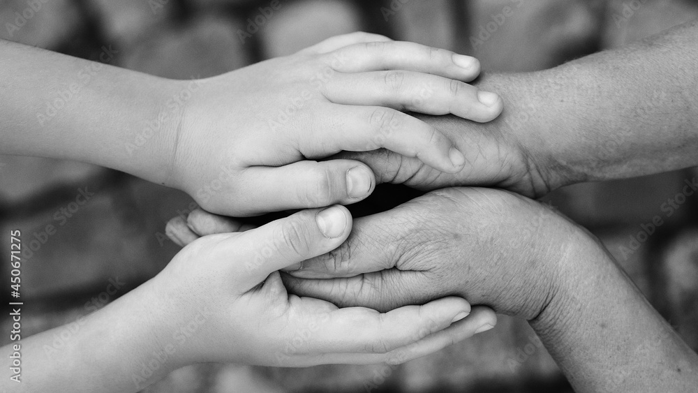Close up of senior and kid holding hands. Family, care and support concept. Grandparent with grandchild. Close up of senior and kid holding hands. Family, care and support concept. Grandparent with grandchild.