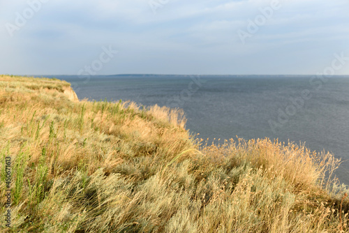 Picturesque slope of the sea coast on a warm summer day