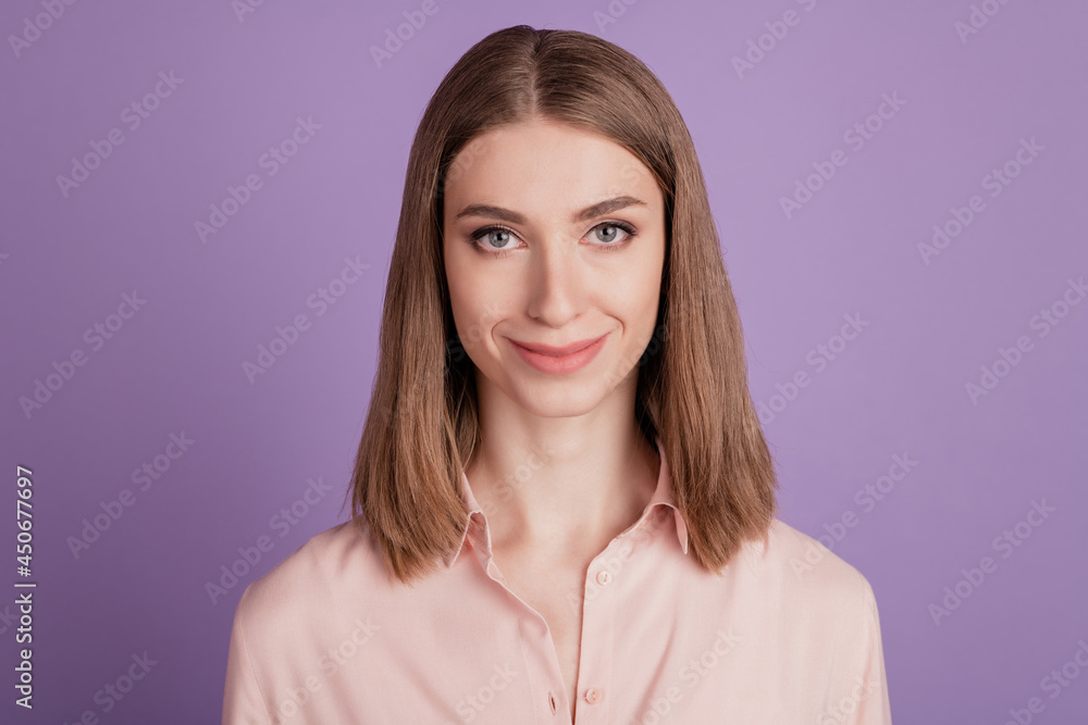 Photo of attractive positive cute nice girl happy positive smile confident smart isolated violet color background Photo of attractive positive cute nice girl happy positive smile confident smart isolated violet color background