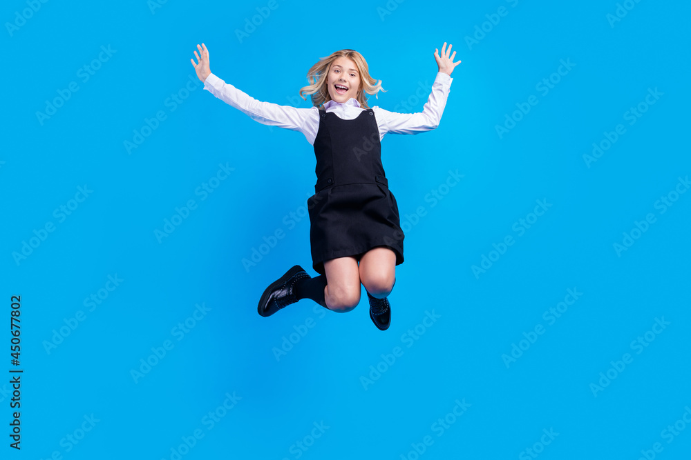 Full size photo of happy positive pretty young girl jump up amazed enjoy isolated on pastel blue color background