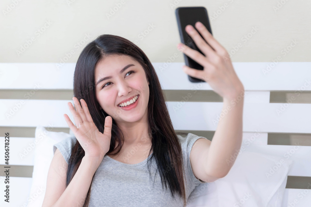 lifestyle portrait beautiful Asian woman with feeling happiness in successful using smartphone take a photo yourself , background with building in city urban lifestyle portrait beautiful Asian woman with feeling happiness in successful using smartphone take a photo yourself , background with building in city urban