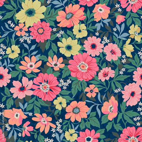 Seamless vector floral pattern. Liberty background of bright colorful realistic flowers. Print with bouquets of flowers from the garden. Bright yellow and pink chrysanthemums on a blue background. 