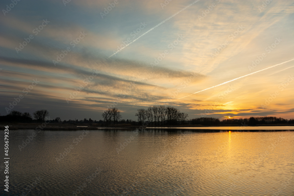 Beautiful sunset and clouds over the lake Beautiful sunset and clouds over the lake