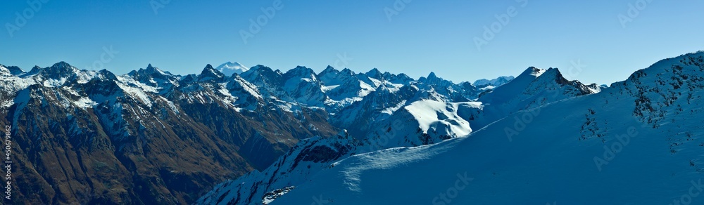 Snow-capped mountain peaks of the Caucasus Mountain Range. Northern snowy mountains of the Caucasus.