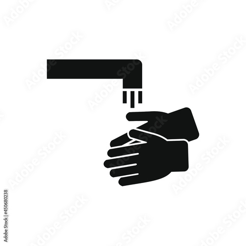 hands under the running water faucet