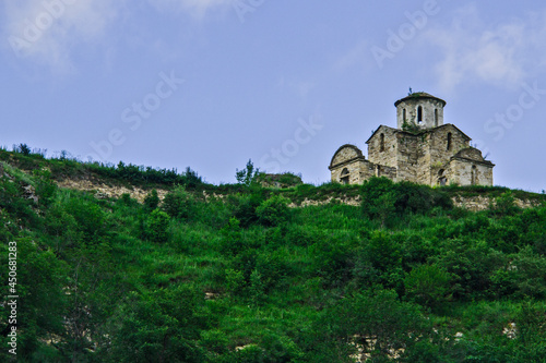 An ancient temple in the mountains of the North Caucasus. Sentinsky Temple. Abandoned building