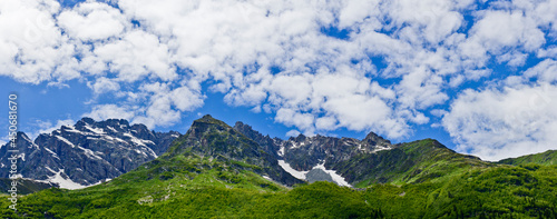 Mountains of the North Caucasus of Russia. Russian nature. Green valleys panoramic view. In the clouds and fog.