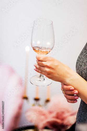 person holding a glass with wine