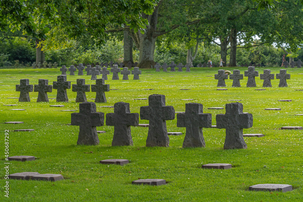Naklejka premium La Cambe, France - 08 03 2021: Normandy German military cemetery and Memorial and the black crosses
