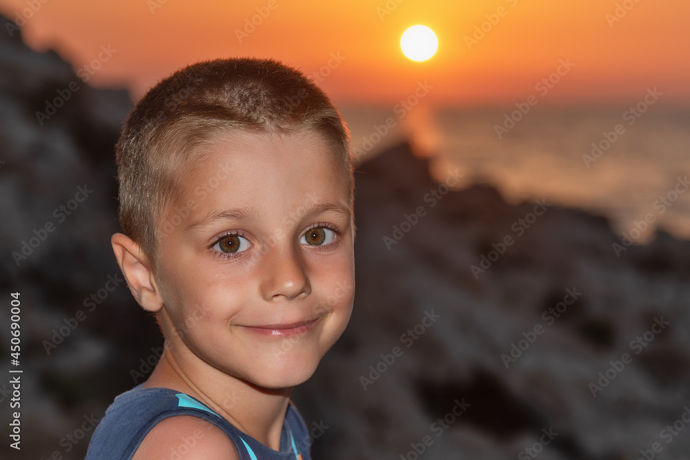 A nice boy on the beach at sunset A nice boy on the beach at sunset
