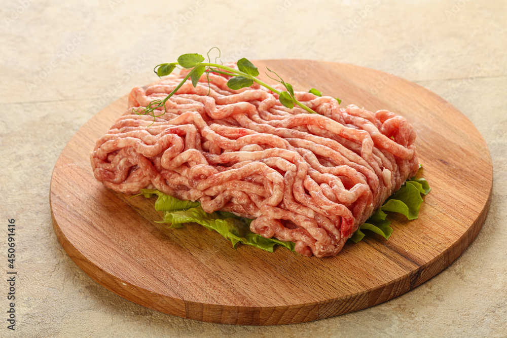 Raw minced pork meat over board Raw minced pork meat over board