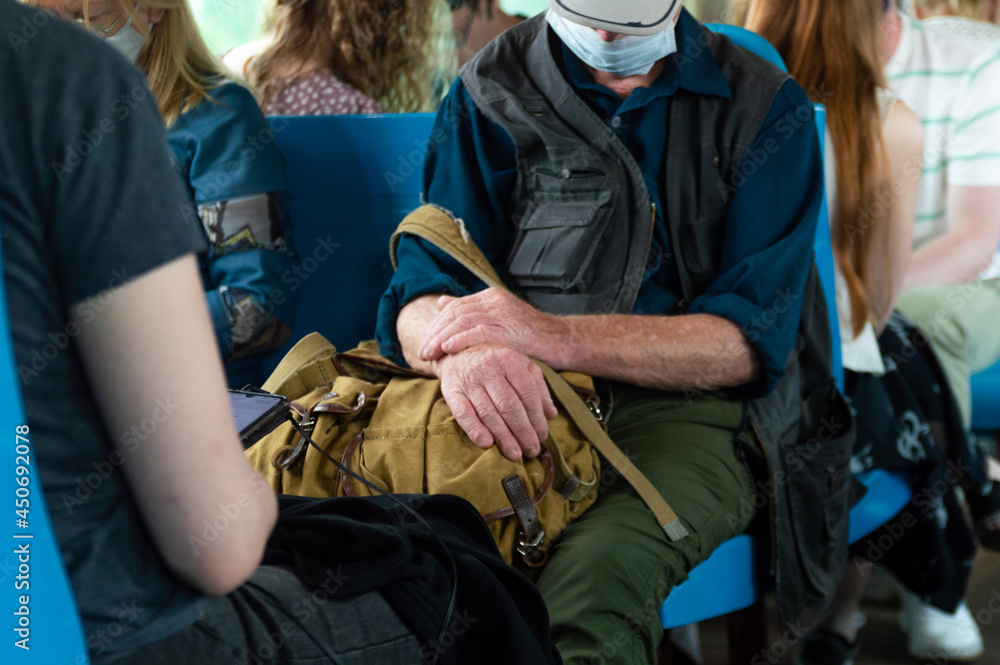 people in medical masks in the commuter train