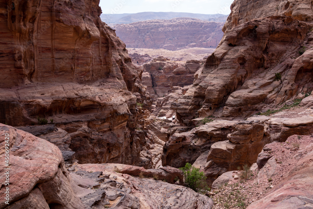 View of the mountain canyon in Wadi Rum. The city of Petra. Historical and archaeological city in southern JordanRed mountains against the blue sky.