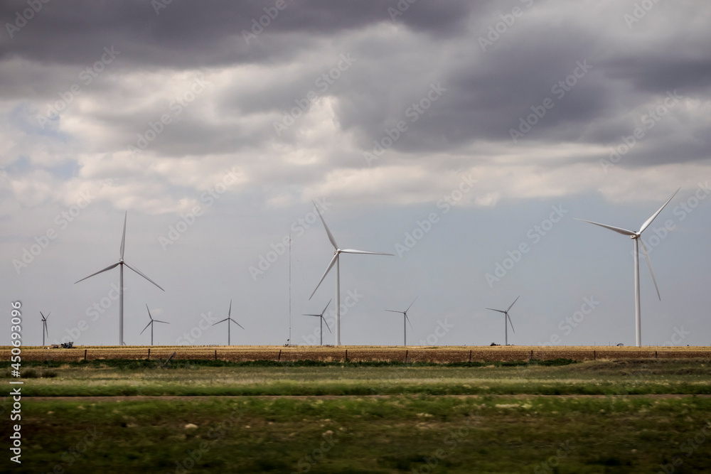Wind turbines generate electricity near farms in West Texas. Wind turbines generate electricity near farms in West Texas.
