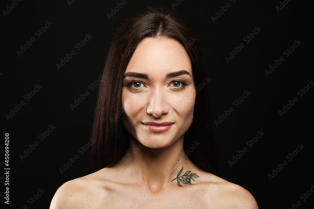 Fototapeta premium Portrait of pretty young woman with gorgeous chestnut hair on black background