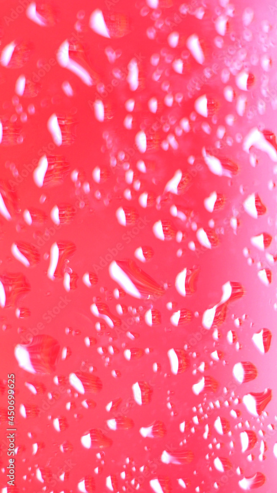 Vertical mobile format for smartpone stories. Close focus on water drop on colorful glass. Vertical mobile format for smartpone stories. Close focus on water drop on colorful glass.