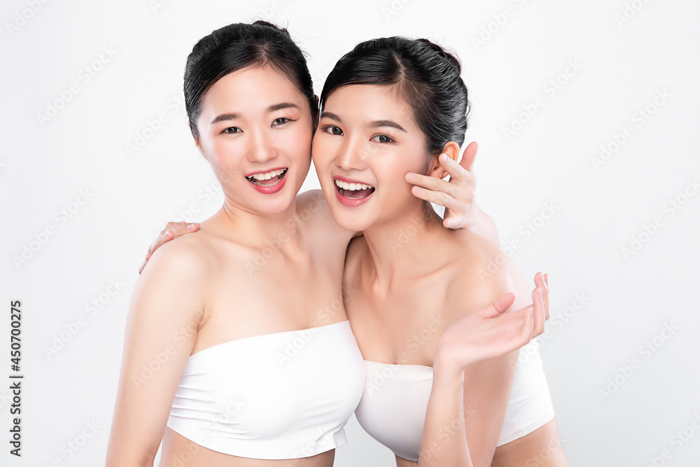 Two Beautiful young asian woman with clean fresh skin on white background, Face care, Facial treatment, Cosmetology, beauty and spa, Asian women portrait. Two Beautiful young asian woman with clean fresh skin on white background, Face care, Facial treatment, Cosmetology, beauty and spa, Asian women portrait.
