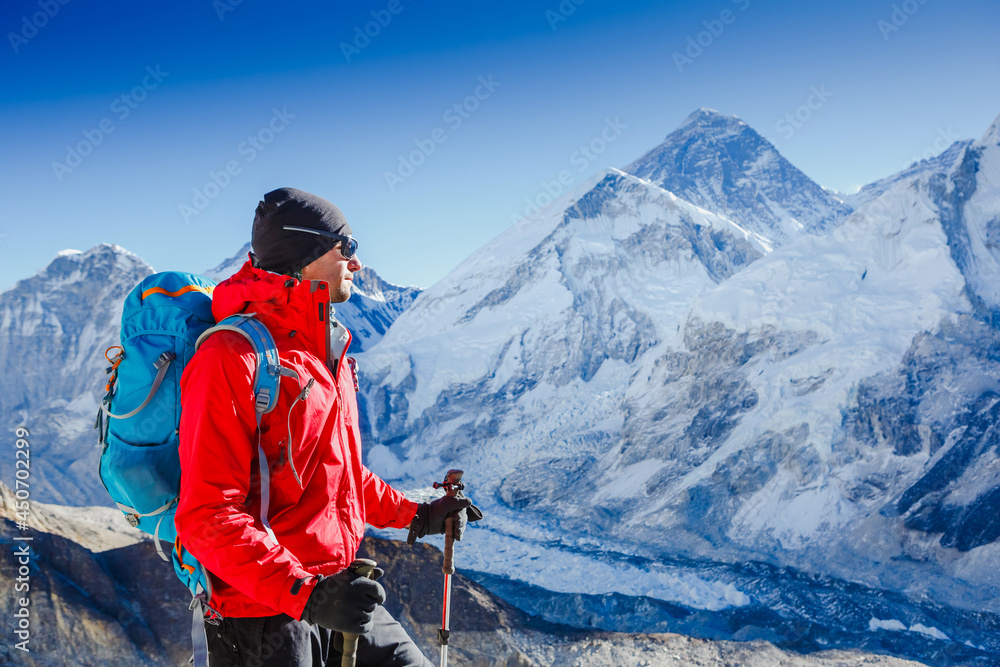 Hiking in Himalaya mountains. Face to face with mount Everest, Earth's highest mountain. Travel sport lifestyle concept Hiking in Himalaya mountains. Face to face with mount Everest, Earth's highest mountain. Travel sport lifestyle concept
