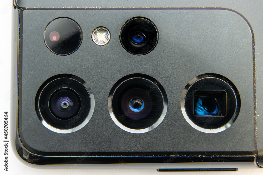 Smartphone Photography, optical and lens concept. Close up of Camera assembly on modern smartphone reveal multiple camera with different focal length for adaptive zooming. Smartphone Photography, optical and lens concept. Close up of Camera assembly on modern smartphone reveal multiple camera with different focal length for adaptive zooming.