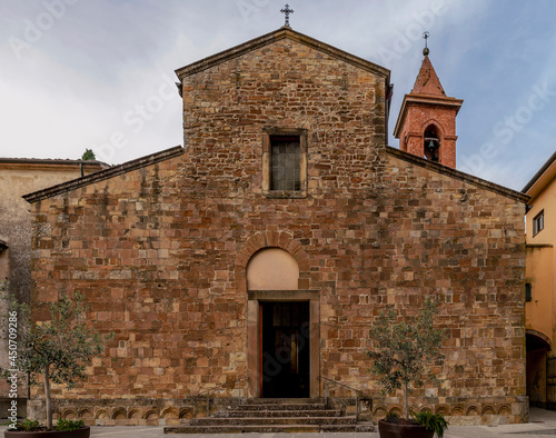 The facade of thr ancient church of Santa Maria Assunta in Fabbrica di Peccioli, Pisa, Italy photo