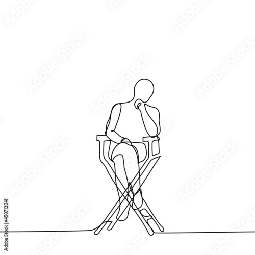 man sits on a high wooden chair - one line drawing. concept director sits in a folding director's chair and observes or reflects photo