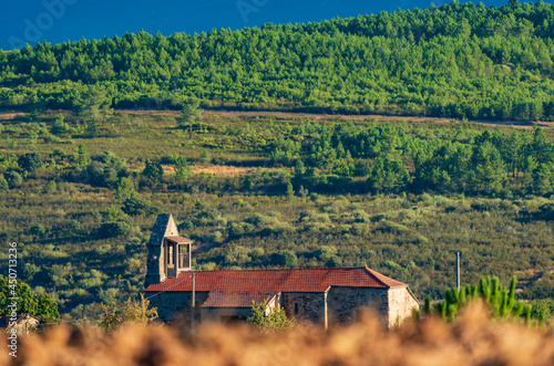 Antique church over the blurred hillside photo