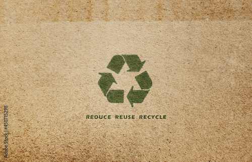 Reduce reuse recycle (3Rs rule). Recycle sign on cardboard. Brown paper background.