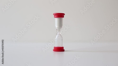 Hourglass. The sands move through the hourglass. Waste of time and deadline concept.	