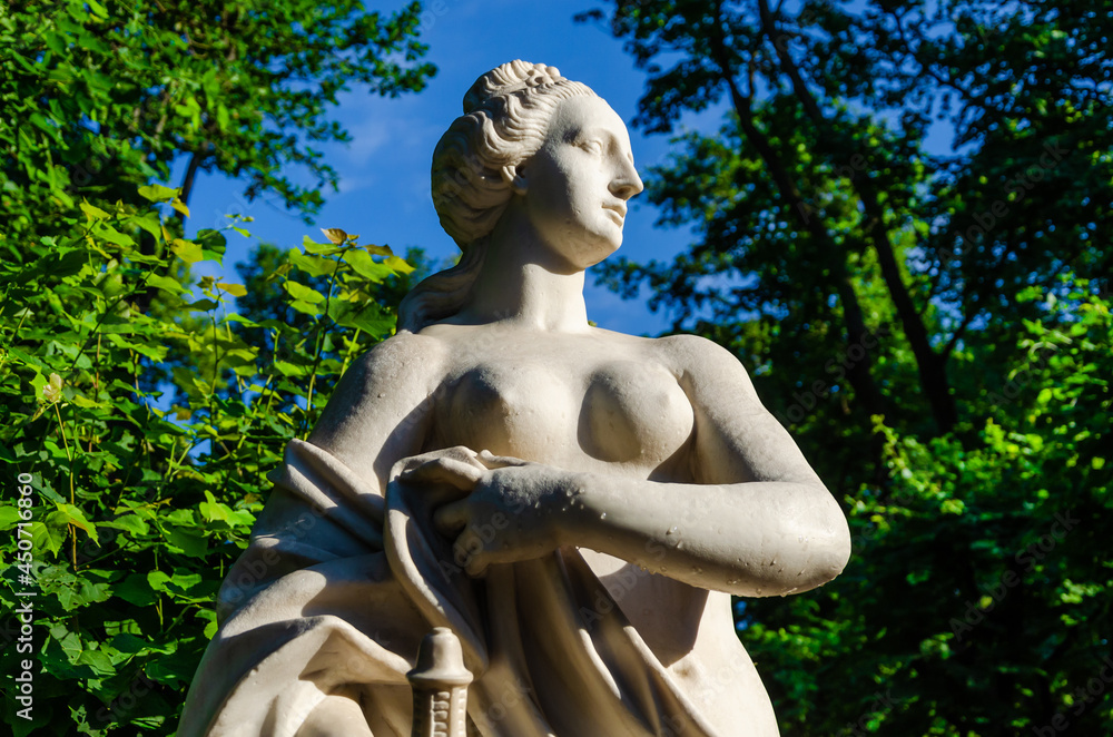 An ancient marble sculpture in the park. An ancient marble sculpture in the park.