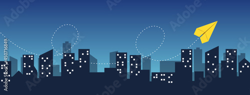 Paper airplane flying over the night city