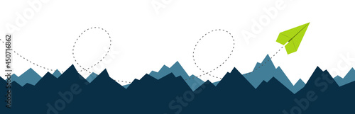 Paper airplane flies over the hills