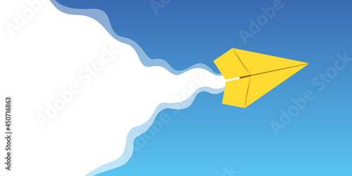 yellow paper plane flies in the blue sky