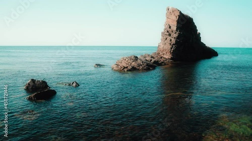 High angle view of natural landmark The stone ships in the Black sea, Bulgaria. Colorful landscape of rocks in calm blue sea water during a sunny day. Waves crashing on coast