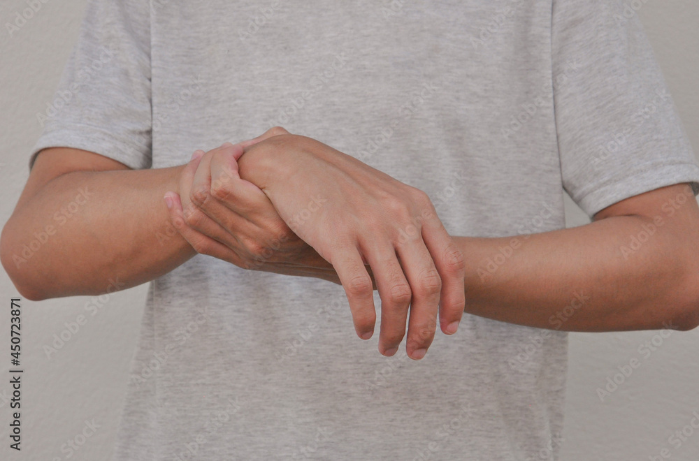 a man support his arms which pain,numbness,weakness,paralysis concept of Guillain barre syndrome