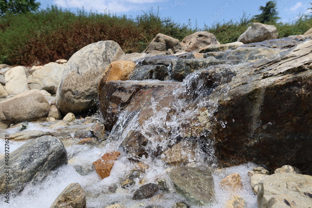 Water Flowing over Rocks in a Small Stream Water Flowing over Rocks in a Small Stream