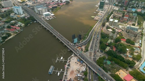 Traffic and cityscape of Victoria Island, Lagos, Nigeria featuring Falomo Bridge, Lagos Law school and the Civic centre tower photo