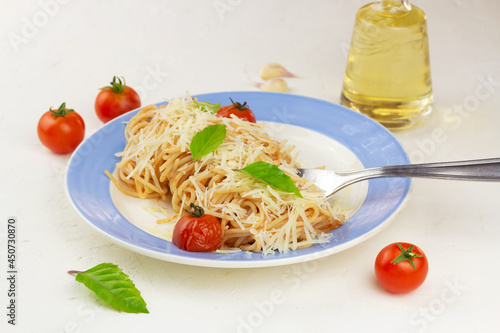 Pasta with tomato sause, cherry tomatoes and basil