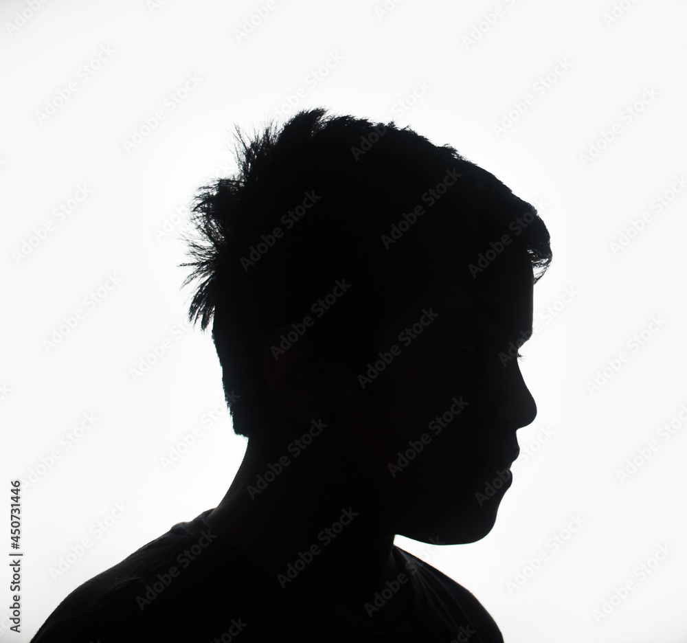 isolated, silhouette child boy looking down sad
