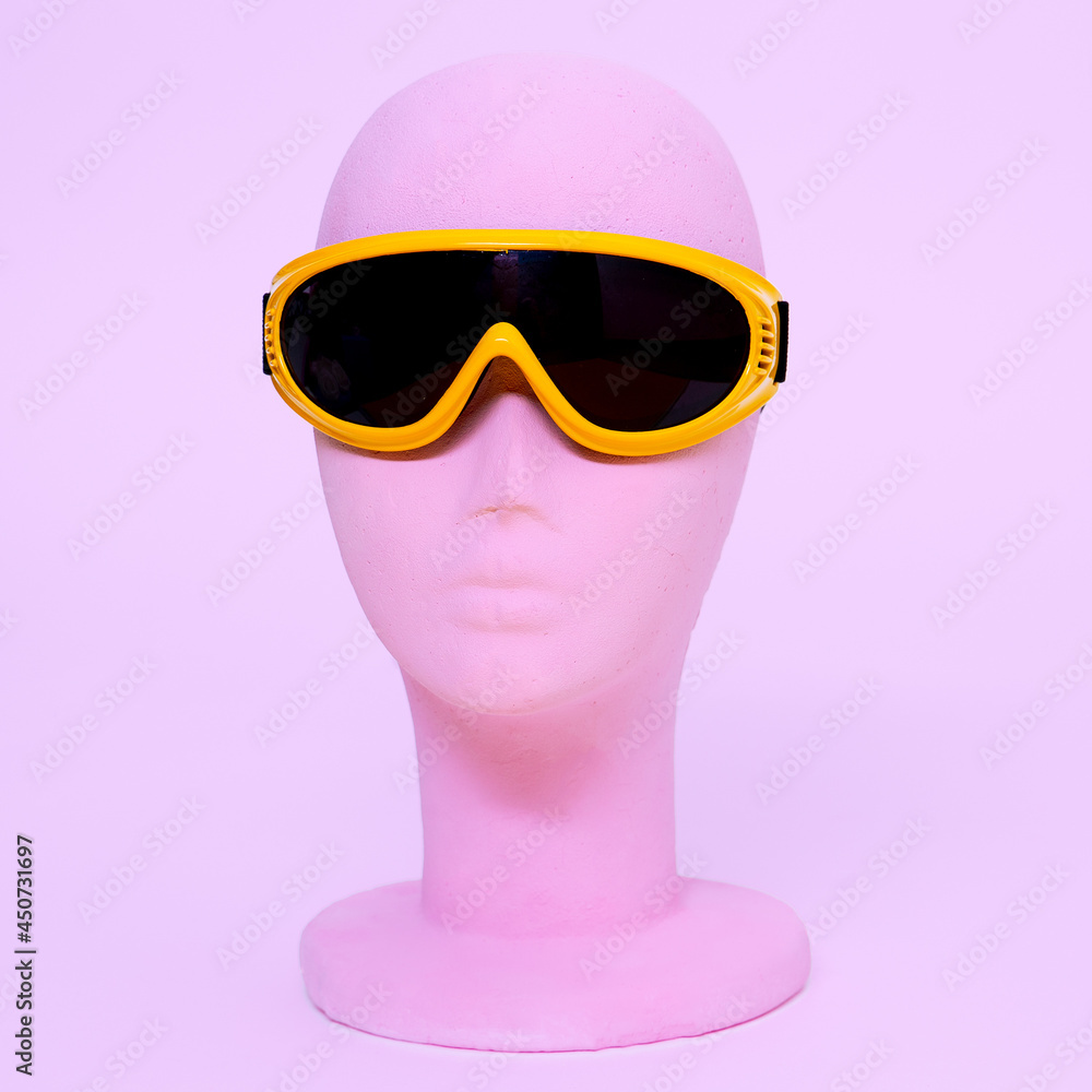 Dummy fashion girl in stylish sport sunglasses. Snowboard style. Sale and shopping trendy accessories concept Dummy fashion girl in stylish sport sunglasses. Snowboard style. Sale and shopping trendy accessories concept