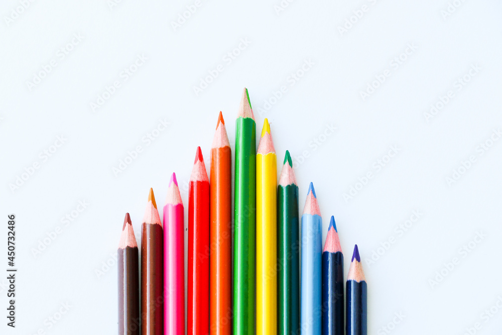 colored pencils in the center of the white background colored pencils in the center of the white background