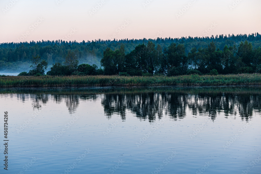 Morning view on the Svir river. Fog over the water.