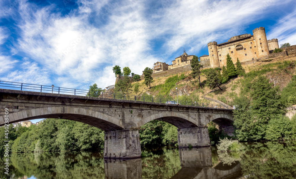 View of the monumental town of Puebla de Sanabria, Spain, and bridge over river Tera.