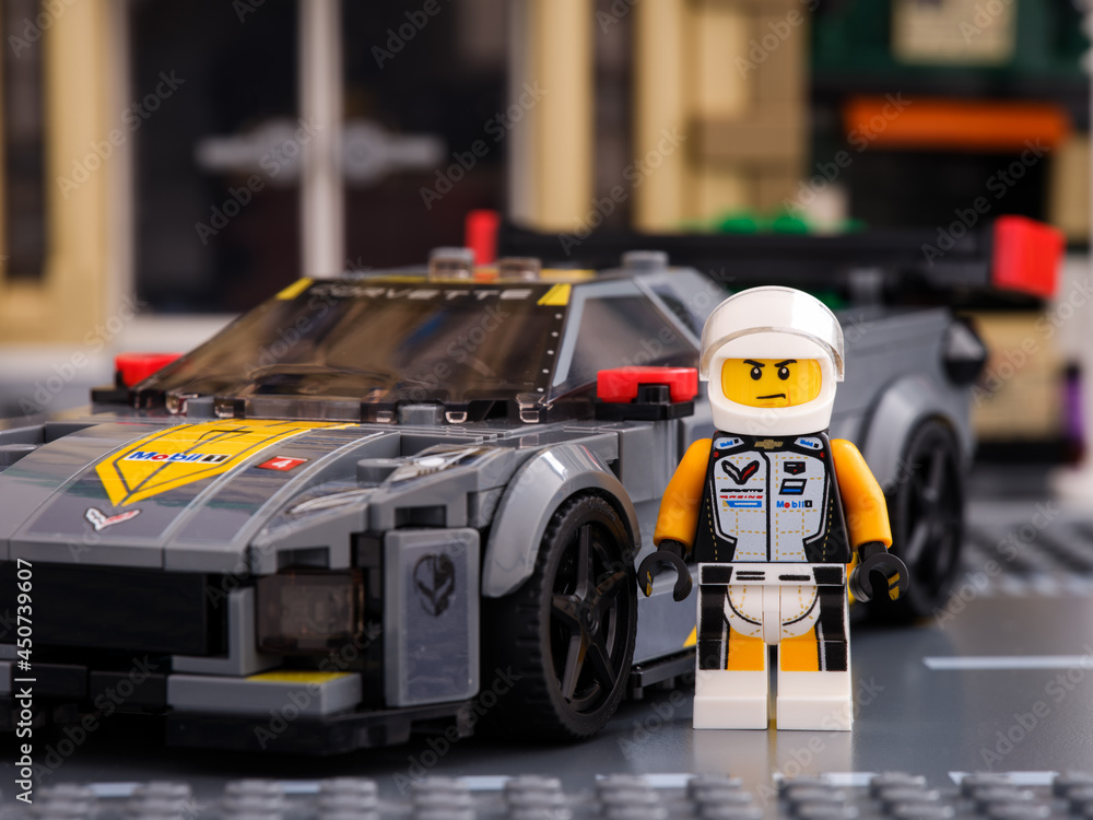 Tambov, Russian Federation - July 02, 2021 Lego Chevrolet Corvette C8.R  race car driver minifigure by LEGO Speed Champions standing near his car.  Stock Photo | Adobe Stock