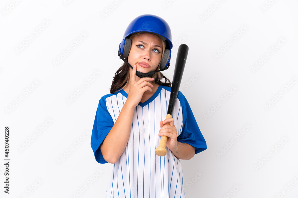 Baseball Russian girl player with helmet and bat isolated on white background having doubts while looking up Baseball Russian girl player with helmet and bat isolated on white background having doubts while looking up