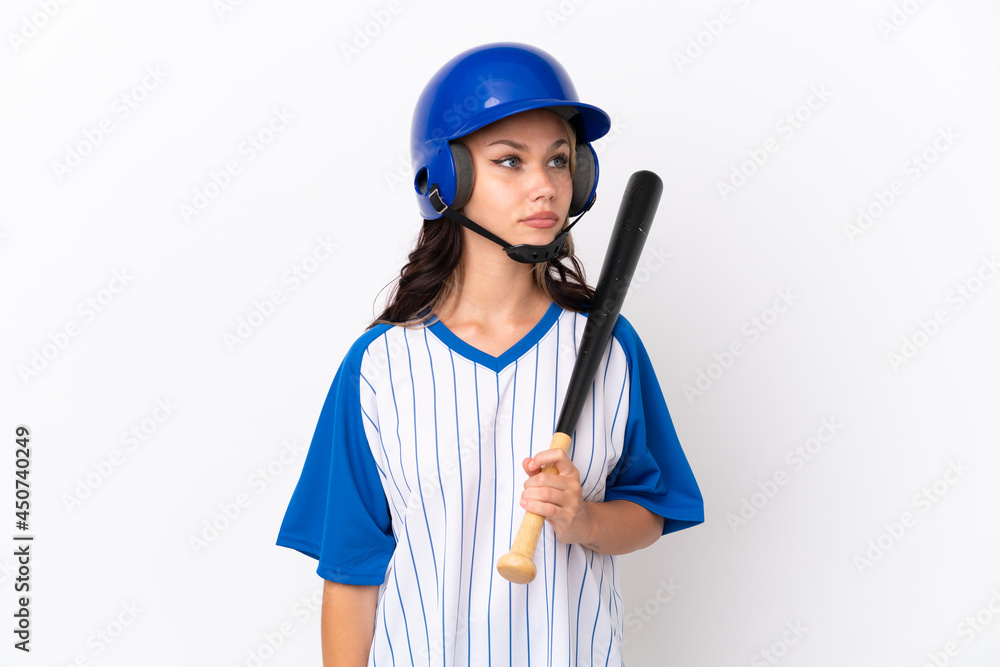 Baseball Russian girl player with helmet and bat isolated on white background looking to the side